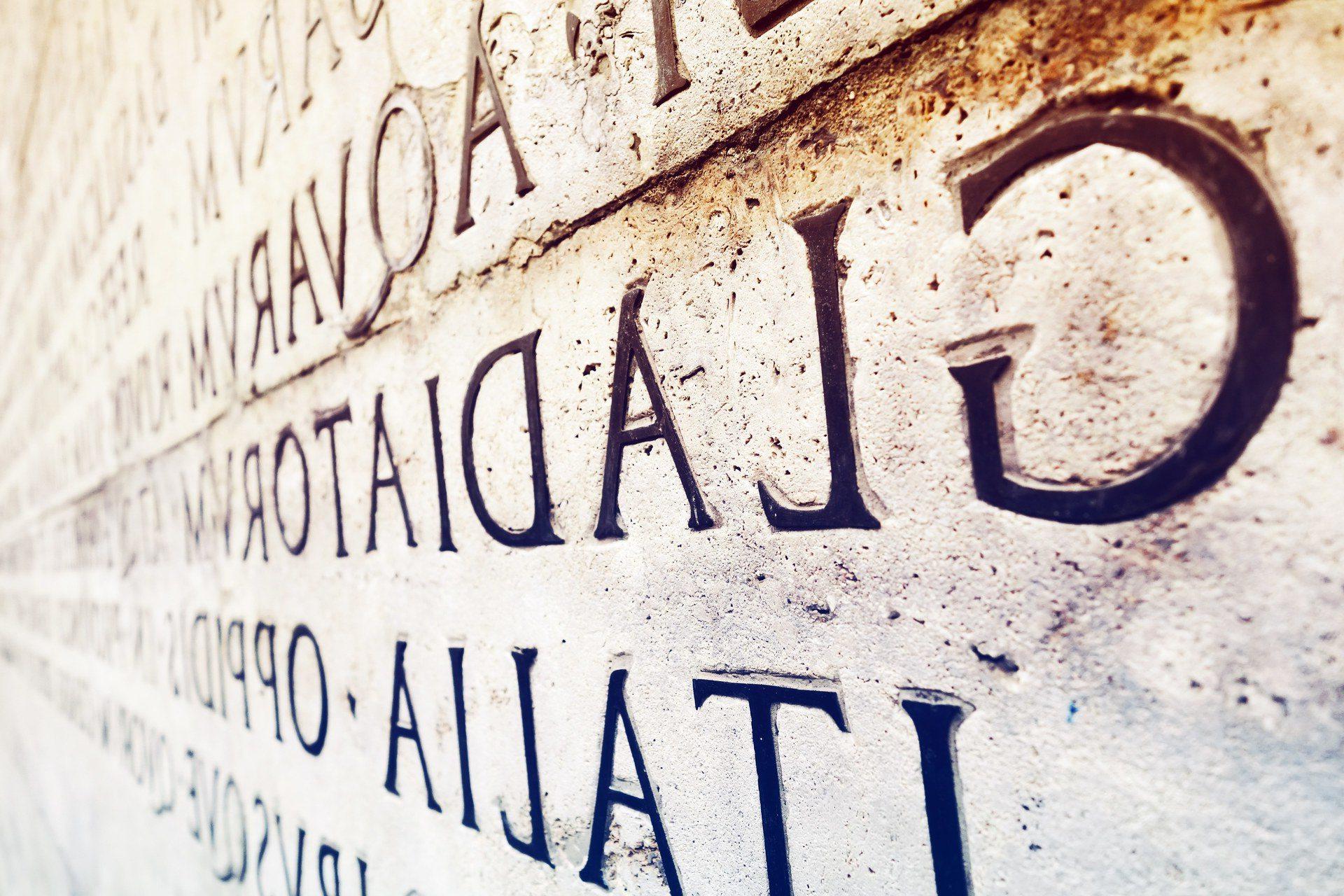 Latin inscription on  wall in Rome, Italy